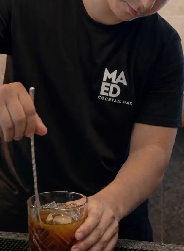 Bartender preparing drinks at the bar