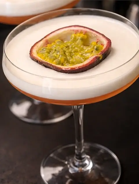 Porn Star Martini cocktail on an orange background
