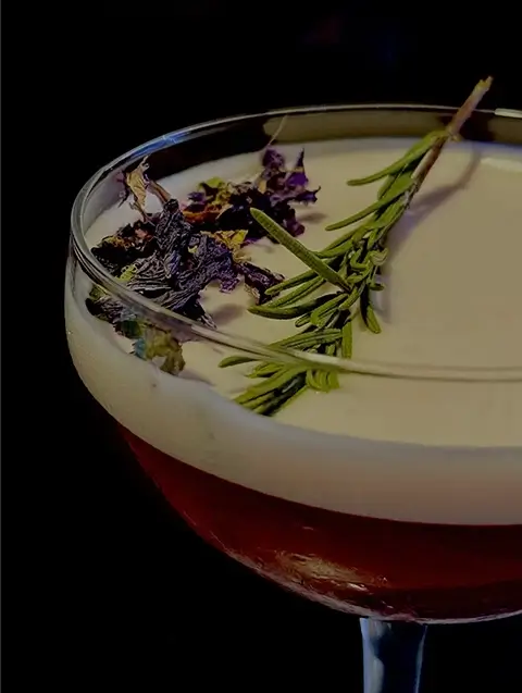 My First Kiss cocktail on an orange background