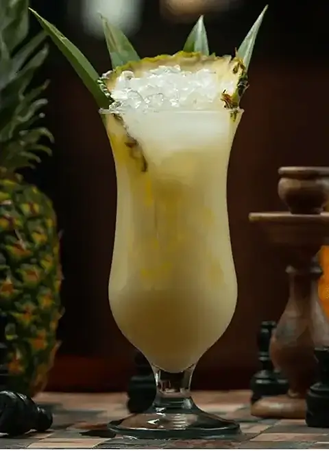 Creamy Piña Colada cocktail garnished with pineapple